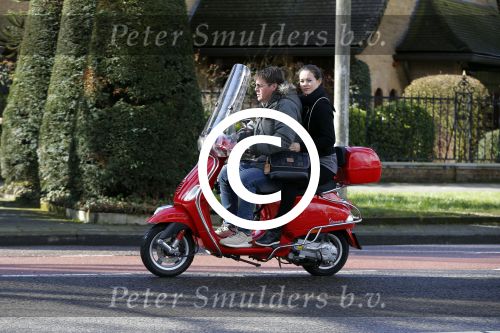 Amsterdam 8 maart 2016
Martijn Krabbe met zijn vriendin Noi Pakon op zijn vespa scooter.