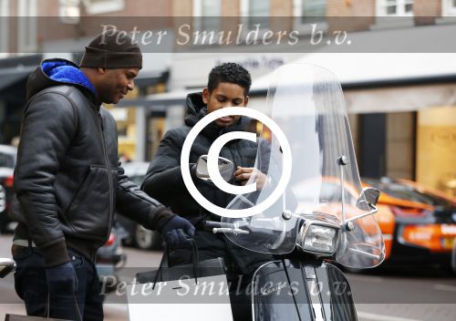 Amnsterdam 13 februari 2016 
Roue Verveer bij zijn zoon achter op de vespa scooter
