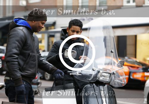 Amnsterdam 13 februari 2016 
Roue Verveer bij zijn zoon achter op de vespa scooter