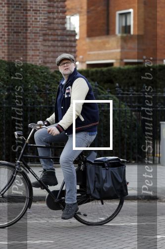 Amsterdam 5 maart 2018 
Patrick Stoof met zijn dochter op de fiets in Amsterdam