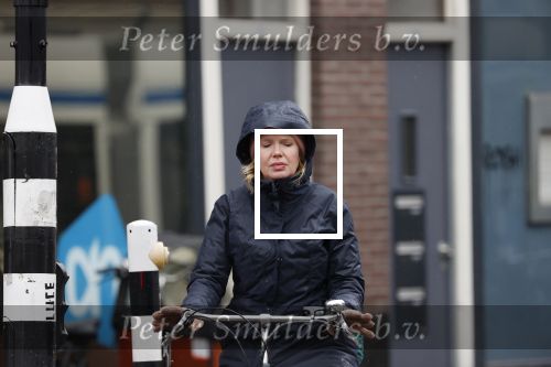 Amsterdam 2 maart 2020
Tjitske Reidinga met zoon in de regen op de fiets.