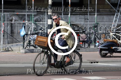 Amsterdam 23 april 2015  
Jos v Raak op de fiets bij ihet Paleis op de Dam.