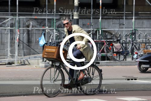 Amsterdam 23 april 2015  
Jos v Raak op de fiets bij ihet Paleis op de Dam.