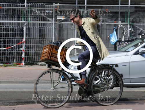 Amsterdam 23 april 2015  
Jos v Raak op de fiets bij ihet Paleis op de Dam.