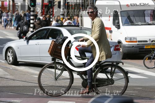 Amsterdam 23 april 2015  
Jos v Raak op de fiets bij ihet Paleis op de Dam.