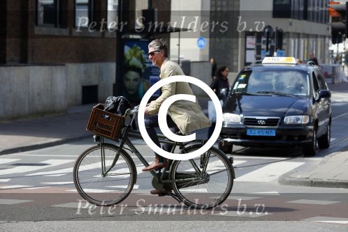 Amsterdam 23 april 2015  
Jos v Raak op de fiets bij ihet Paleis op de Dam.