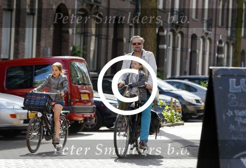 Amsterdam 21 april 2015  
Patrick Stoof met dochter op de fiets.