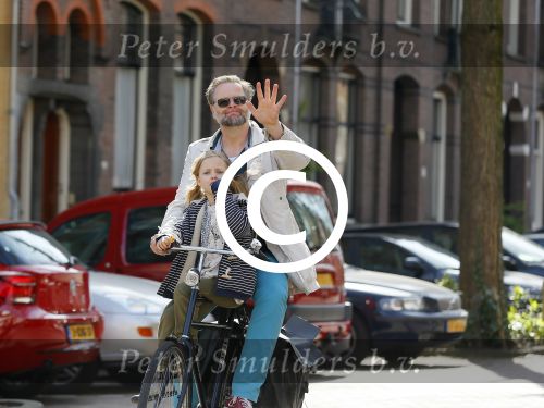 Amsterdam 21 april 2015  
Patrick Stoof met dochter op de fiets.