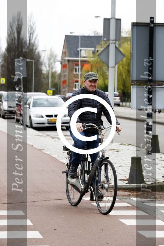 Amsterdam 18 april 2016 
Henk Poort op de fiets in Amsterdam.