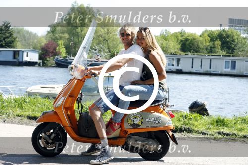 Amsterdam 7 mei 2016 
Michelle van Nood en haar vriend Koen Brouwer op hun vespa scooter. Michelle en Koen zijn de populaire deelnemers aan het RTL programma SOS survival of the Sexes