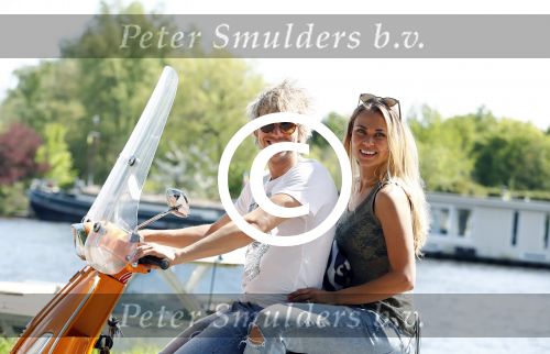 Amsterdam 7 mei 2016 
Michelle van Nood en haar vriend Koen Brouwer op hun vespa scooter. Michelle en Koen zijn de populaire deelnemers aan het RTL programma SOS survival of the Sexes