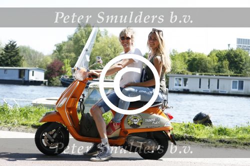 Amsterdam 7 mei 2016 
Michelle van Nood en haar vriend Koen Brouwer op hun vespa scooter. Michelle en Koen zijn de populaire deelnemers aan het RTL programma SOS survival of the Sexes