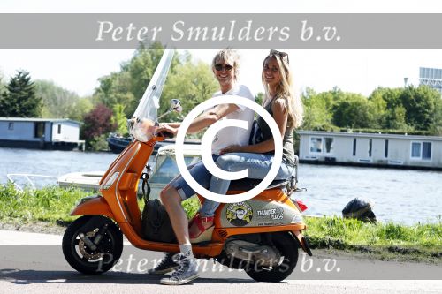 Amsterdam 7 mei 2016 
Michelle van Nood en haar vriend Koen Brouwer op hun vespa scooter. Michelle en Koen zijn de populaire deelnemers aan het RTL programma SOS survival of the Sexes