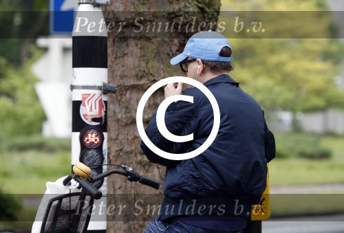 Amsterdam 13 mei 2017  
Marc Marie Huijbregts op zijn froene fiets in Amsterdam.