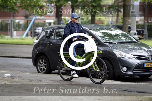 Amsterdam 13 mei 2017  
Marc Marie Huijbregts op zijn froene fiets in Amsterdam.