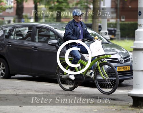 Amsterdam 13 mei 2017  
Marc Marie Huijbregts op zijn froene fiets in Amsterdam.