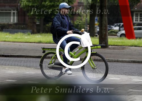 Amsterdam 13 mei 2017  
Marc Marie Huijbregts op zijn froene fiets in Amsterdam.