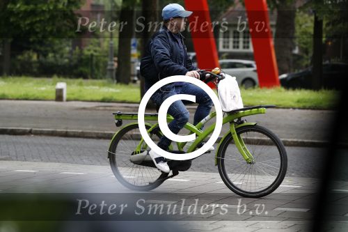Amsterdam 13 mei 2017  
Marc Marie Huijbregts op zijn froene fiets in Amsterdam.