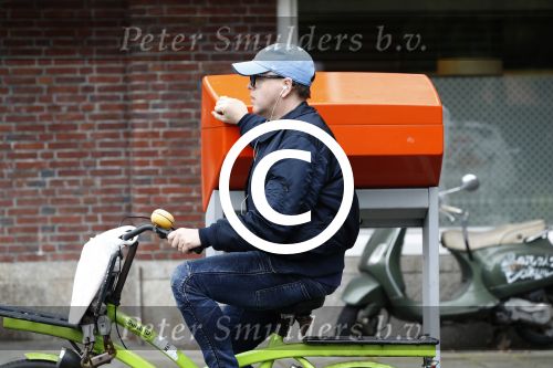 Amsterdam 13 mei 2017  
Marc Marie Huijbregts op zijn froene fiets in Amsterdam.