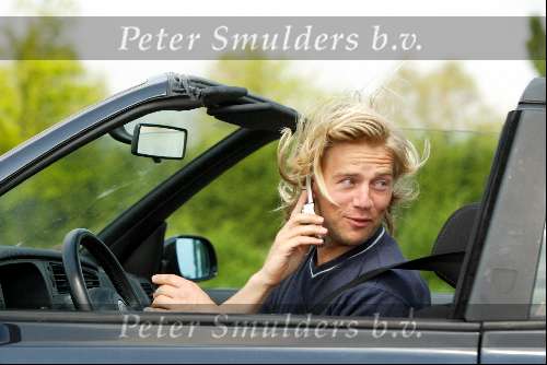 Den Haag16 mei 2002
Antonie Kamerling met gsm achter het stuur van zijn cabrio