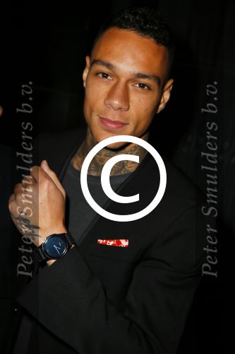 Amsterdam 9 n ovember 2015
Life after football LAF gala in het INK hotel. Gregory v d Wiel met zijn samsung BLAR. horloge