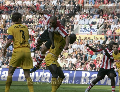 Eindhoven, 20 Oktober 2006 
Kompetitiewedstrijd PSV-Roda JC Seizoen 2006/2007
Eindstand 4-1
Alex PSV in de aanval hangend op de rug van Pa Modou Kah