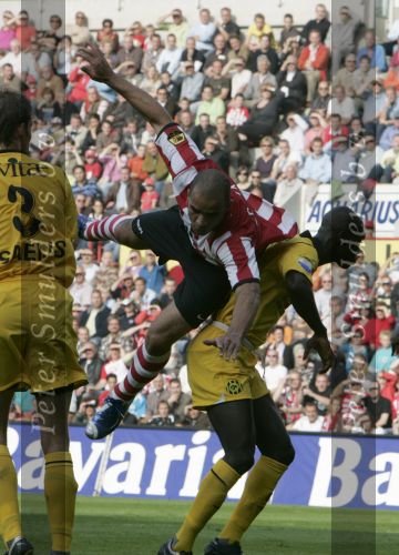 Eindhoven, 20 Oktober 2006 
Kompetitiewedstrijd PSV-Roda JC Seizoen 2006/2007
Eindstand 4-1
Alex PSV in de aanval hangend op de rug van Pa Modou Kah
