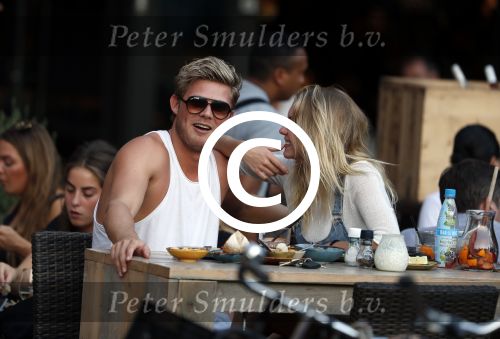 Amsterdam 12 september 2016 
Tim Douwsma en zijn vriendin Jessie Jazz Vuijk op terras en op de scooter