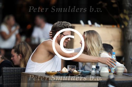 Amsterdam 12 september 2016 
Tim Douwsma en zijn vriendin Jessie Jazz Vuijk op terras en op de scooter