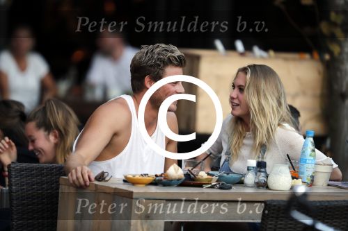 Amsterdam 12 september 2016 
Tim Douwsma en zijn vriendin Jessie Jazz Vuijk op terras en op de scooter