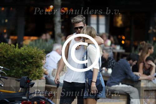 Amsterdam 12 september 2016 
Tim Douwsma en zijn vriendin Jessie Jazz Vuijk op terras en op de scooter