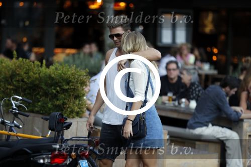 Amsterdam 12 september 2016 
Tim Douwsma en zijn vriendin Jessie Jazz Vuijk op terras en op de scooter
