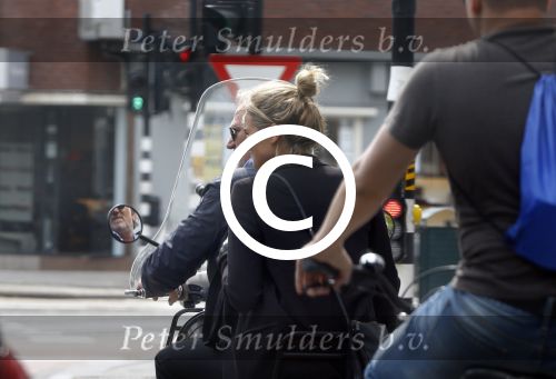 Amsterdam 21 augustus 2013
Lieke v Lexmond samen met haar manager Frank Wisse op vespa scooter.
Peter Smulders bv