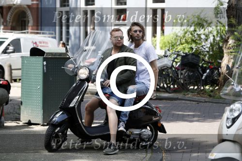 Amsterdam 21 juli 2017
Jamai Loman met zijn vriend Michael Muller op hun vespa scooter