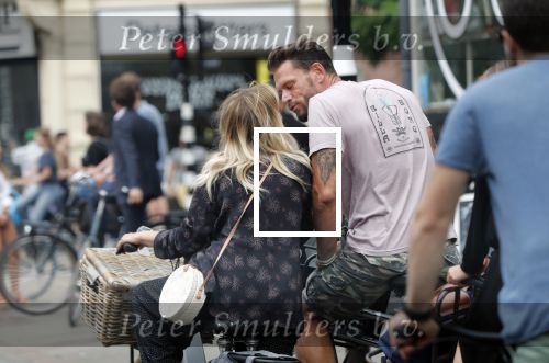 Amsterdam 28 augustus 2019
Candy Dulfer met vriend Rafael op terras en daarna op de fiets in Amsterdam.