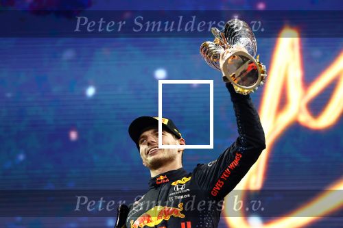 ABU DHABI, UNITED ARAB EMIRATES - DECEMBER 12: Race winner and 2021 F1 World Drivers Champion Max Verstappen of Netherlands and Red Bull Racing celebrates on the podium during the F1 Grand Prix of Abu Dhabi at Yas Marina Circuit on December 12, 2021 in Abu Dhabi, United Arab Emirates. (Photo by Mark Thompson/Getty Images)