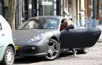 Amsterdam 7 april 2011
Candy Dulfer met gsm en Porsche Cayman op de cornelis schuytstraat.
Peter Smulders bv
