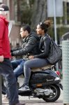 Amsterdam 15 april 2013
Joelle Gullit met vriendje op terras bij joffers en op vespa scooter.
Peter Smulders bv