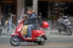 Amsterdam 9 maart 2015 
Martijn Krabbe doet boodschappen op zijn vespa scooter.