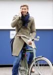 Amsterdam 20 maart 2016 
Evgeniy Levchenko bellend op zijn fiets in amsterdam zuid.