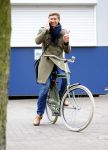 Amsterdam 20 maart 2016 
Evgeniy Levchenko bellend op zijn fiets in amsterdam zuid.