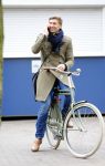 Amsterdam 20 maart 2016 
Evgeniy Levchenko bellend op zijn fiets in amsterdam zuid.