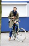 Amsterdam 20 maart 2016 
Evgeniy Levchenko bellend op zijn fiets in amsterdam zuid.