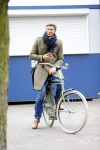 Amsterdam 20 maart 2016 
Evgeniy Levchenko bellend op zijn fiets in amsterdam zuid.
