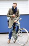 Amsterdam 20 maart 2016 
Evgeniy Levchenko bellend op zijn fiets in amsterdam zuid.