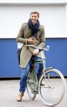 Amsterdam 20 maart 2016 
Evgeniy Levchenko bellend op zijn fiets in amsterdam zuid.