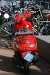 Amsterdam 14 maart 2016 
Gigi Ravelli op haar scooter op de pc hooftstraat