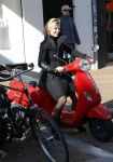 Amsterdam 14 maart 2016 
Gigi Ravelli op haar scooter op de pc hooftstraat