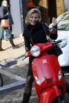 Amsterdam 14 maart 2016 
Gigi Ravelli op haar scooter op de pc hooftstraat