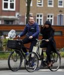 Amsterdam 23 maart 2016 
Gijs Staverman met (een) vriendin op de fiets in Amsterdam.